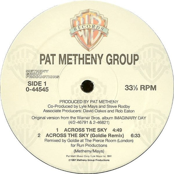 Across The Sky / The Roots Of Coincidence (GOLDIE) | Excellent+ (EX+) Excellent (EX) Retro Vinyl Club