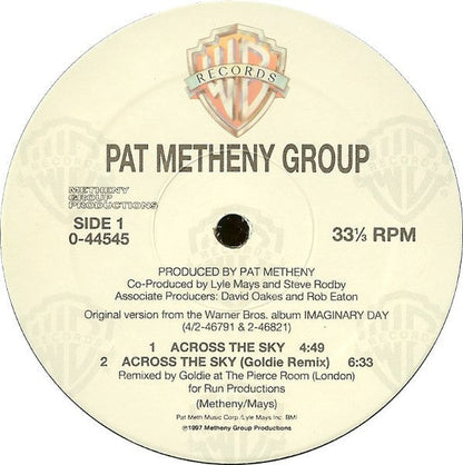 Across The Sky / The Roots Of Coincidence (GOLDIE) | Excellent+ (EX+) Excellent (EX) Retro Vinyl Club