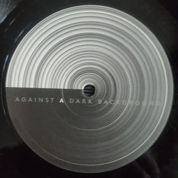 Against A Dark Background |   Retro Vinyl Club