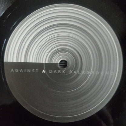 Against A Dark Background |   Retro Vinyl Club