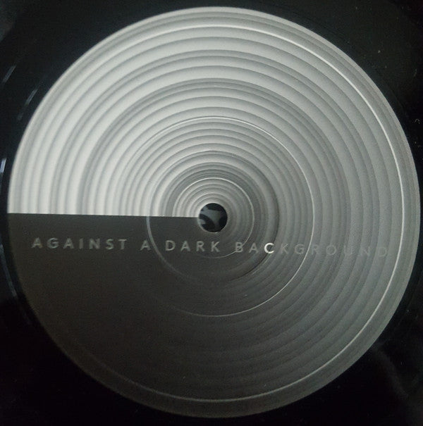 Against A Dark Background |   Retro Vinyl Club