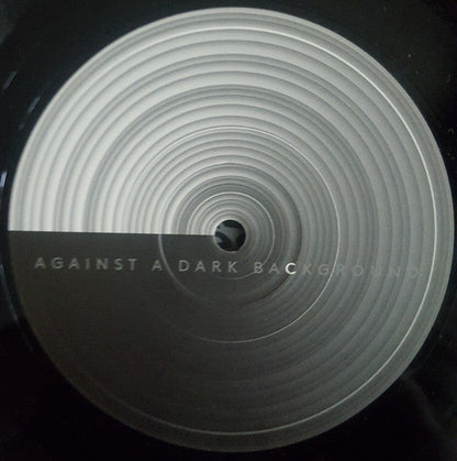 Against A Dark Background |   Retro Vinyl Club