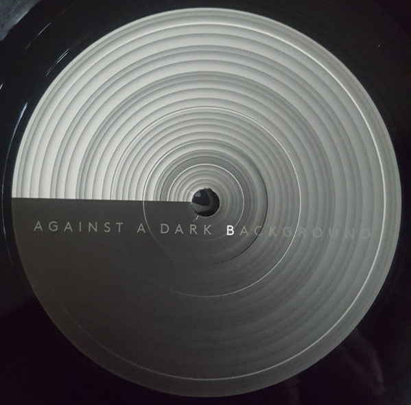 Against A Dark Background |   Retro Vinyl Club