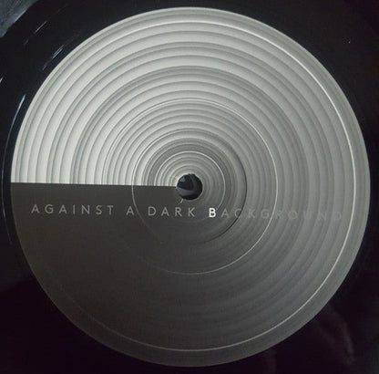 Against A Dark Background |   Retro Vinyl Club